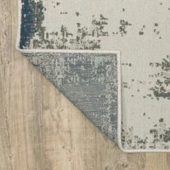 Trinity Modern Distressed Abstract Patio Area Rug Beige/Blue - Captiv8e Designs 18 Trinity Modern Distressed Abstract Patio Area Rug Beige/Blue - Captiv8e Designs -Home Decor Store GUEST 78025ae6 ad6d 4e3a a5d2 2007b50eb263